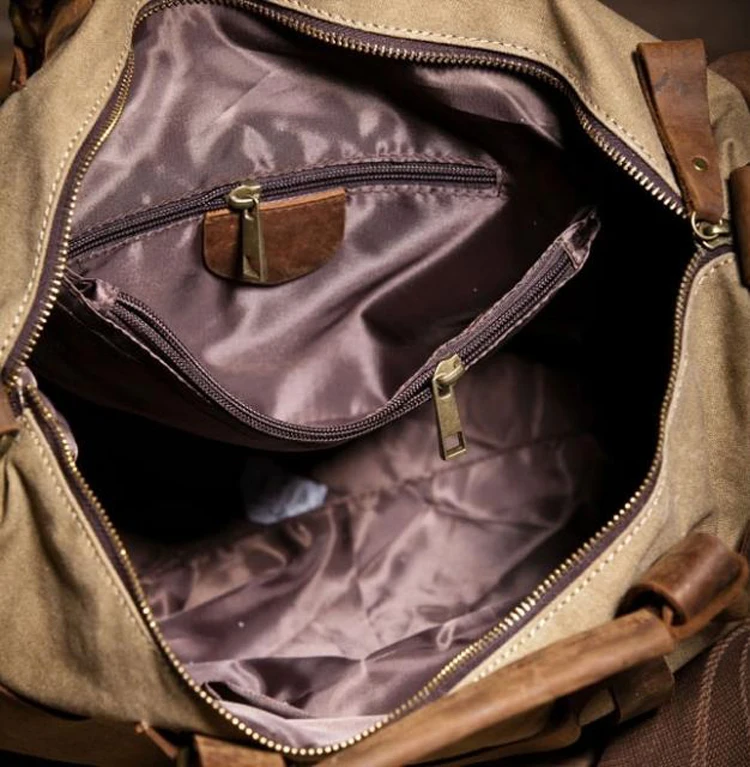 Vintage canvas messenger bag demonstrating durability with leather trim reinforcements
