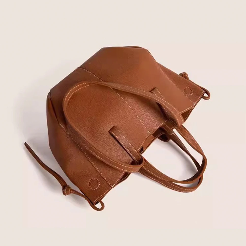Versatile professional laptop tote with compartments showing organized work essentials