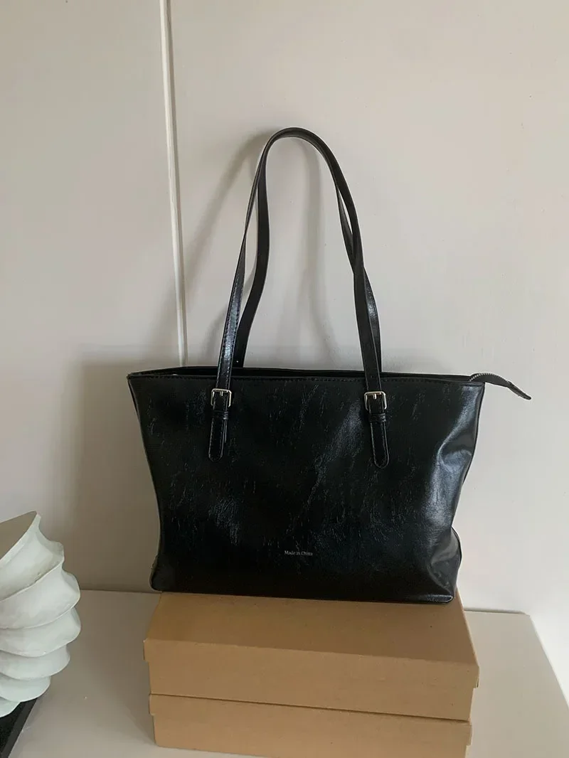 Professional women's leather tote showing versatile styling options