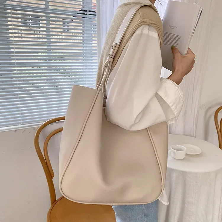 Minimalist leather tote with elegant structure and clean lines for professional environments