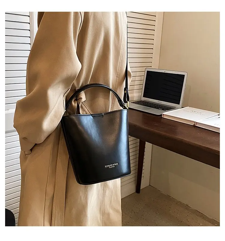 Versatile vegan leather messenger bag with modern professional design