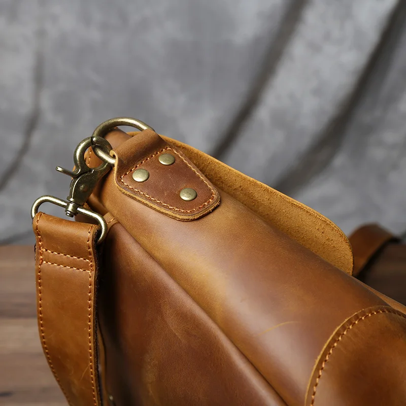 Vintage leather messenger bag that requires proper maintenance to coordinate well with quality footwear