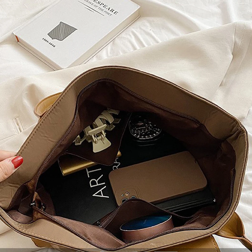 Professional measuring a laptop to ensure perfect fit in leather laptop bag