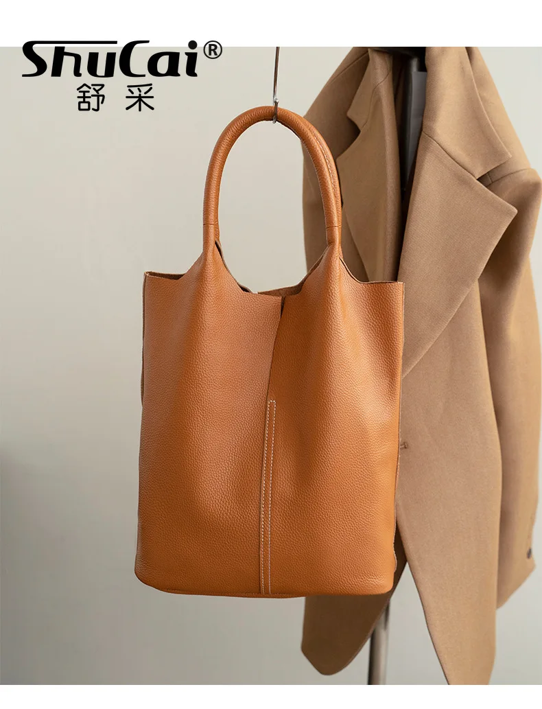 Professional tan leather work tote showing warm tones and natural grain