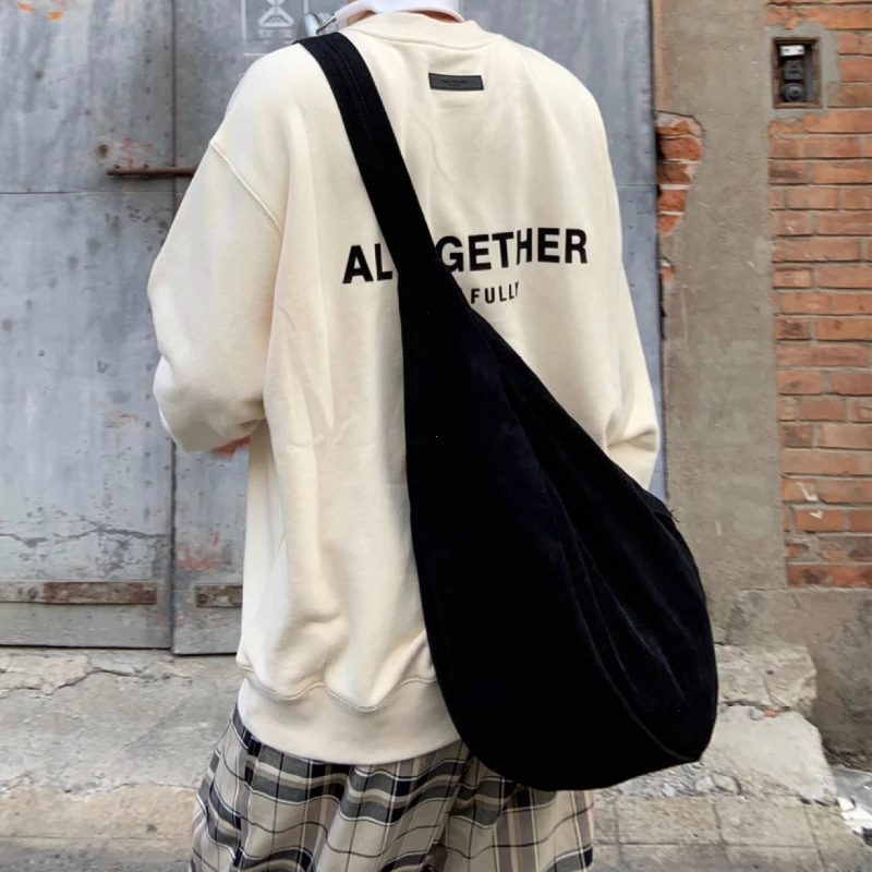 Casual canvas bag with leather trim demonstrating hybrid material approach for versatile professional use