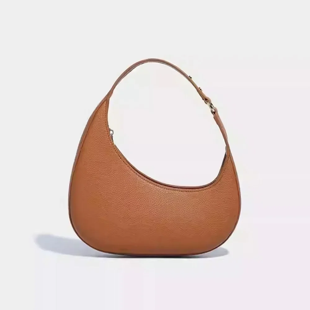 Tan leather tote showing texture and finish variations that affect versatility